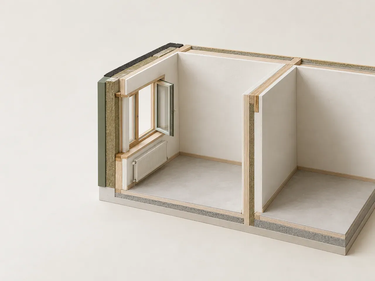 Schnittmodell eines Wohnhauses mit zwei Räumen, Fenster, Heizkörper und sichtbarem Wandaufbau auf einem warmen, hellen Studiogrund.